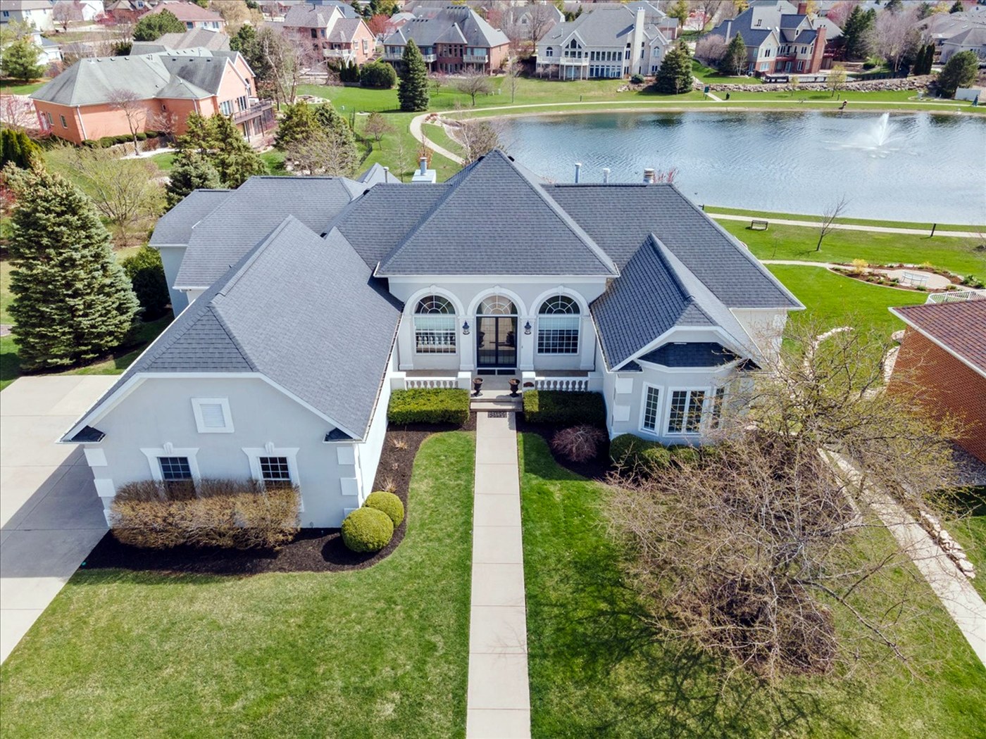 Longwood after renovation — expanded front elevation overlooking the lake