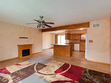 Roland living room before renovation — closed layout, dated finishes